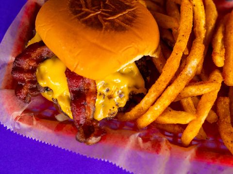 Bacon cheeseburger and seasoned fries at Bar South