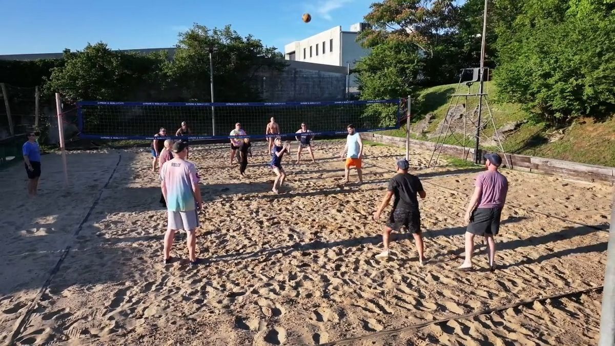 A game on the sand volleyball court at Bar South